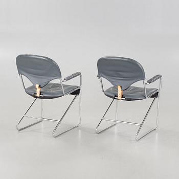 A pair of chairs by Sam Larsson for Dux, designed in 1974.