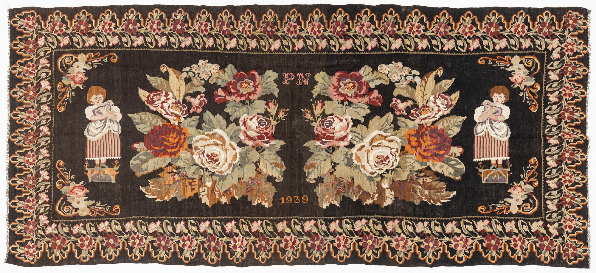 A Kelim carpet, Moldova, dated 1939, circa 385 x 174 cm.