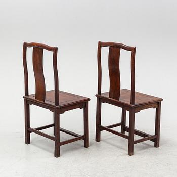 A pair of hardwood chairs, late Qing dynasty.