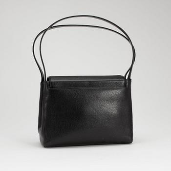 CHANEL, a black caviar leather shoulder bag with gold colored CC lock.