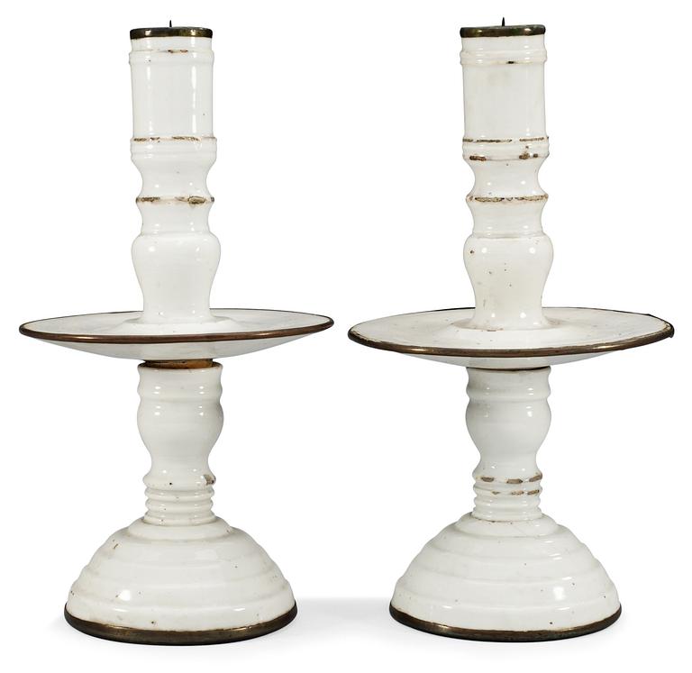 A pair of white glazed candlesticks, Qing dynasty, early 18th Century.