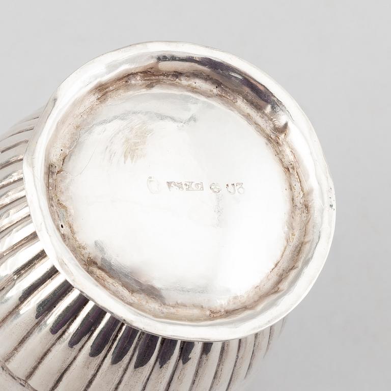 A silver creamer, beaker, and platter, Sweden, 18-19th century.