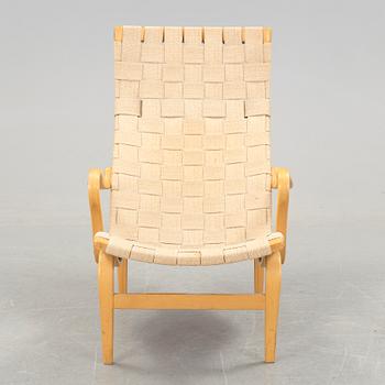 A BRUNO MATHSSON "PERNILLA 2, T. 107" BEECH AND WEBBING ARMCHAIR, Firma Karl Mathsson, Värnamo, Sweden, 1981.