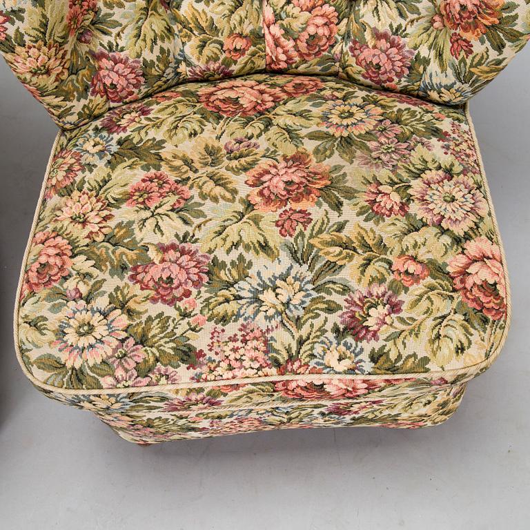 A pair of mid-20th-century armchairs.