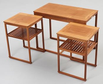 A Carl Malmsten teak set of occasional tables.