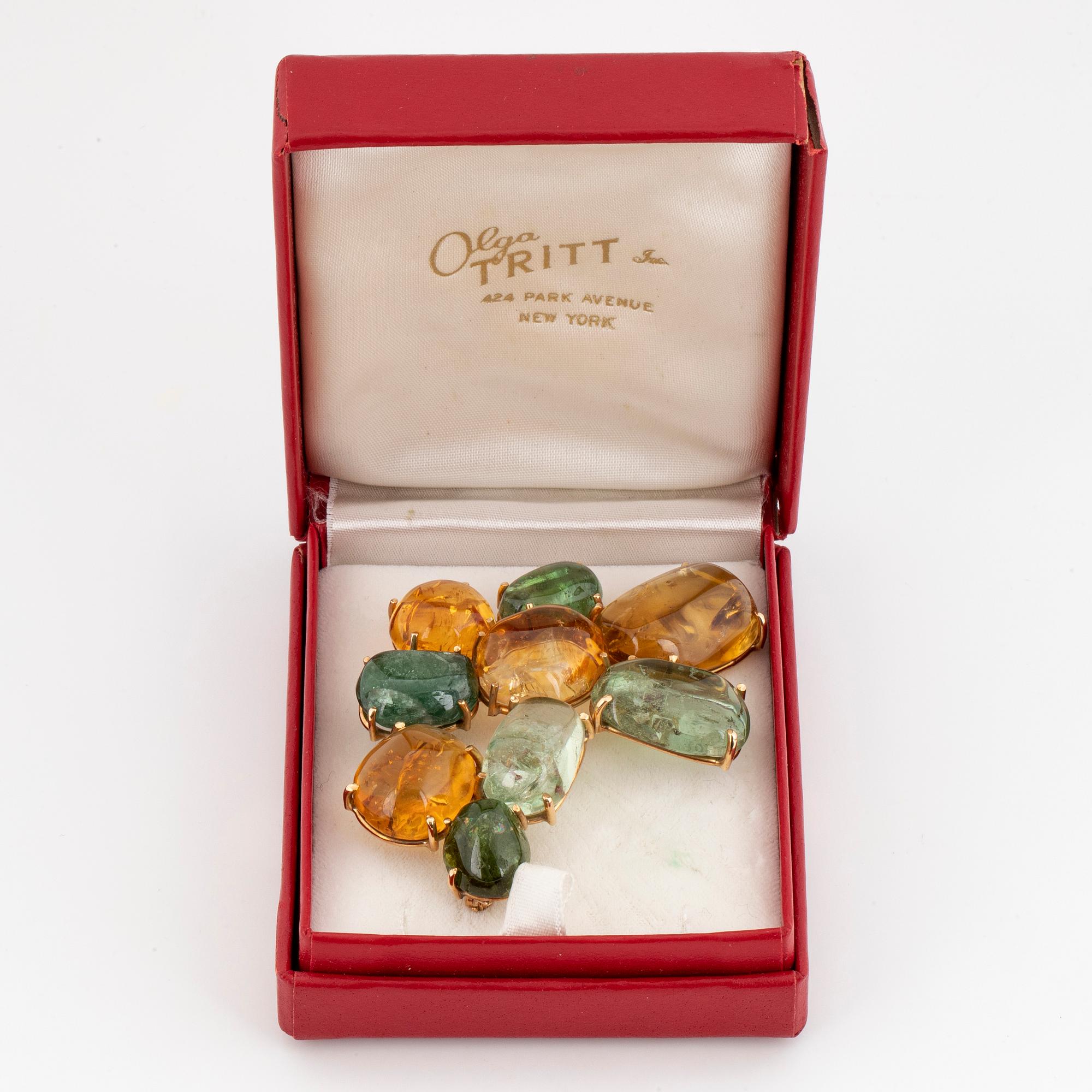 Cabochon-cut citrine and green tourmaline brooch.