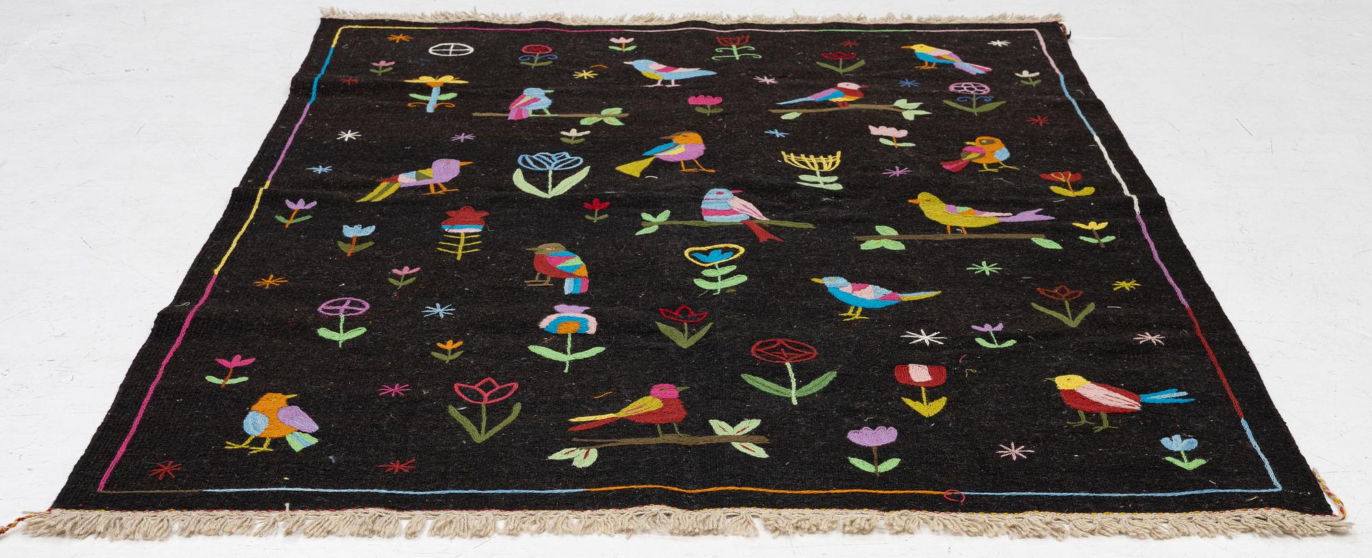 A hand-embroidered Kelim rug, 204 x 150 cm.