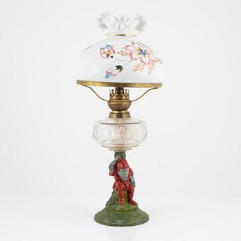 A early 20th century glass kerosene lamp.