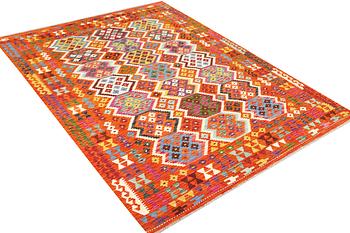 An Afghan kilim rug, c. 290 x 203 cm.