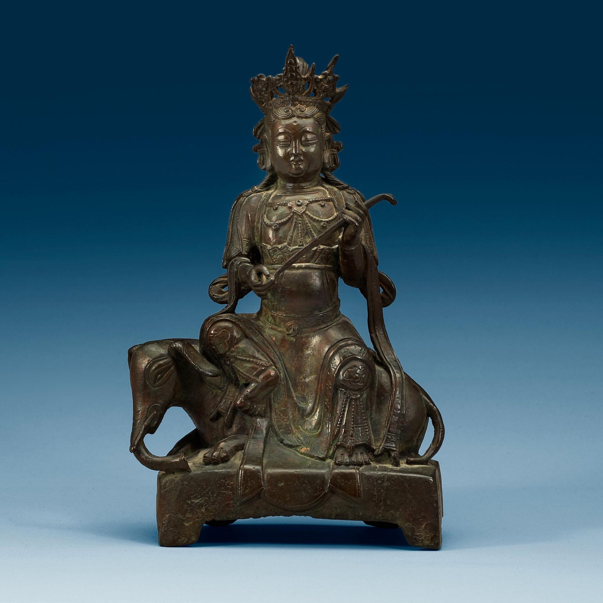 A seated bronze figure of Guanyin on an elephant, Qing dynasty, 19th Century.