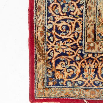 An oriental carpet, c. 290 x 198 cm.