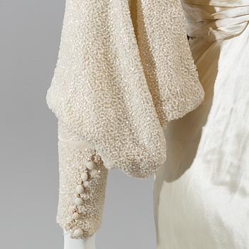 A satin wedding dress, circa 1935.