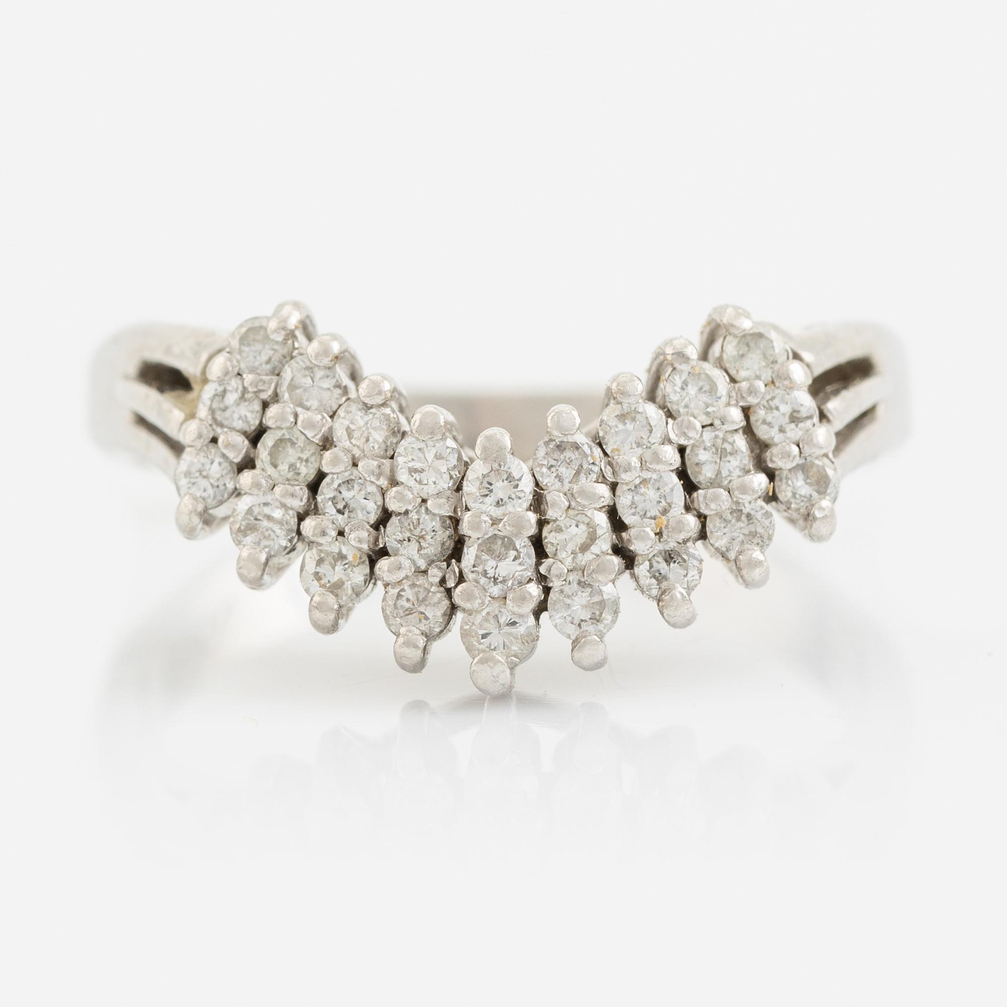 Platinum and round brilliant cut diamond ring.