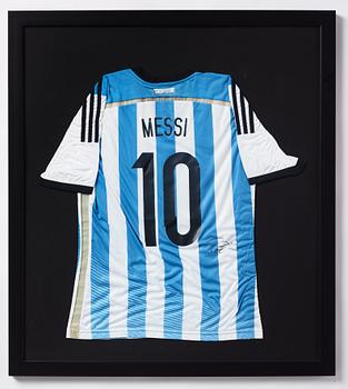 A football shirt, signed by Lionel Messi.