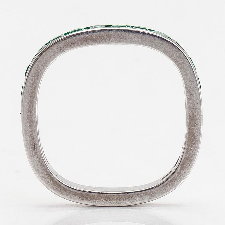 An 18K white gold eternity ring, with square-cut emeralds, Switzerland.