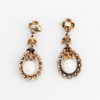 A pair of silver and gold earrings set with pearls and rose-cut diamonds.