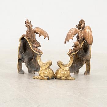 Fire dogs a pair of Baroque style 20th century in the manner of Charles Cressent.