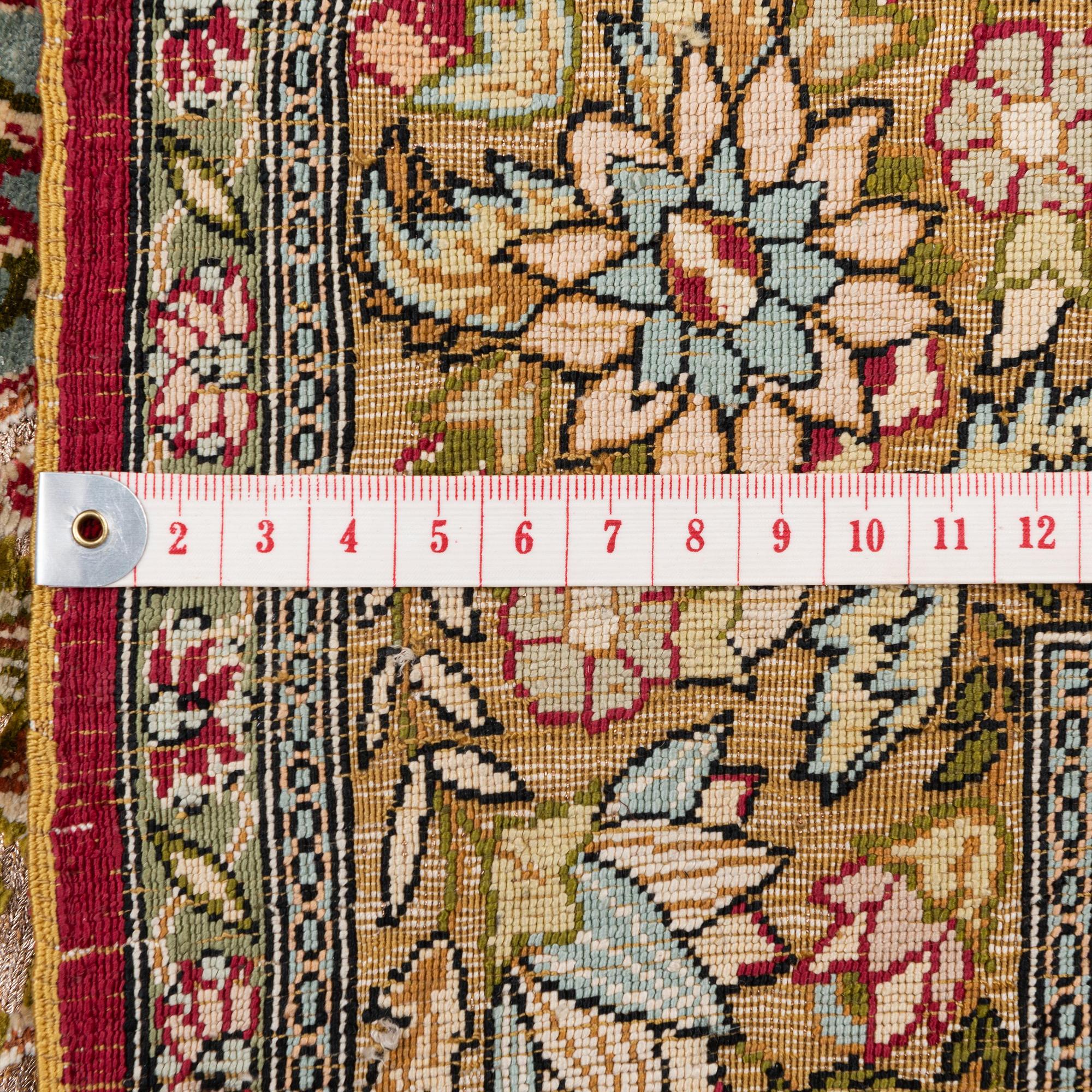 A semi-antique Hereke souf, silk and metal thread rug, West Anatolia, c. 121 x 75 cm.