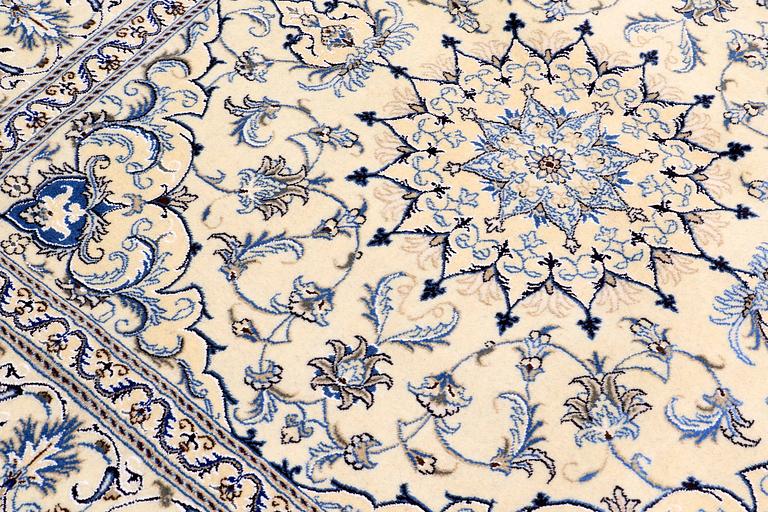 A rug, Nain part silk, ca 197 x 197 cm.