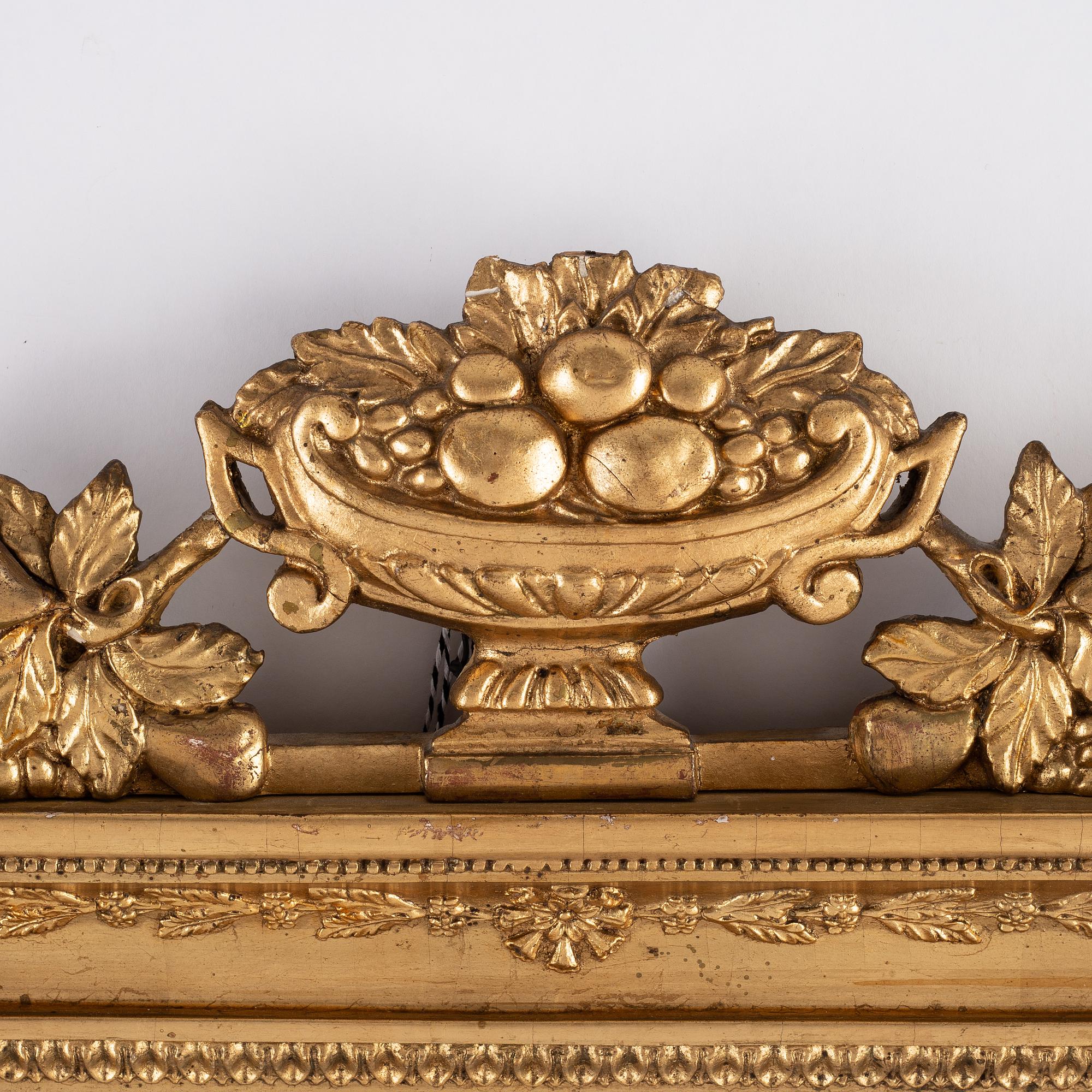 A pair of Swedish Empire mirror wall sconces, first half of the 19th century.