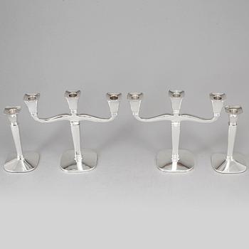 Four (2+2) silver candle holders and candelabras, Germany, 20th century.