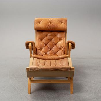 Bruno Mathsson, a "Pernilla" lounge chair with ottoman, DUX, Sweden, late 1900's.