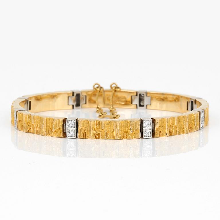 ARMBAND, 18K guld, 16 diamanter, Lapponia, 1984. Vikt ca 30g.
