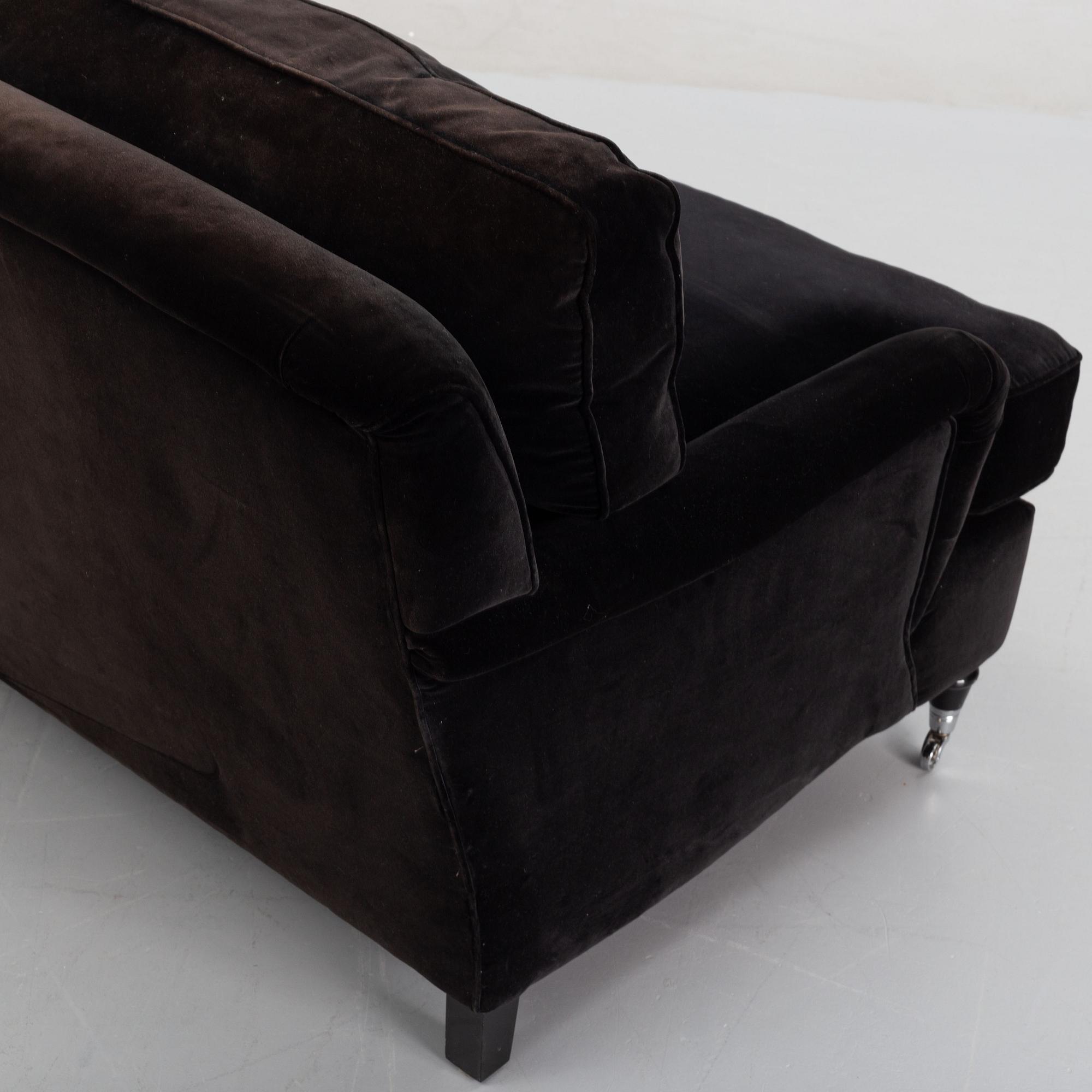 A contemporary velvet Howard sofa.
