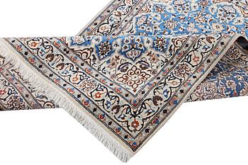 A Nain rug, part silk, c. 190 x 118 cm.