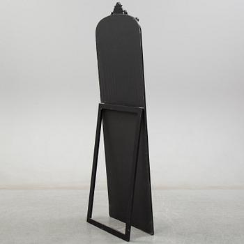 A contemporary floor mirror.