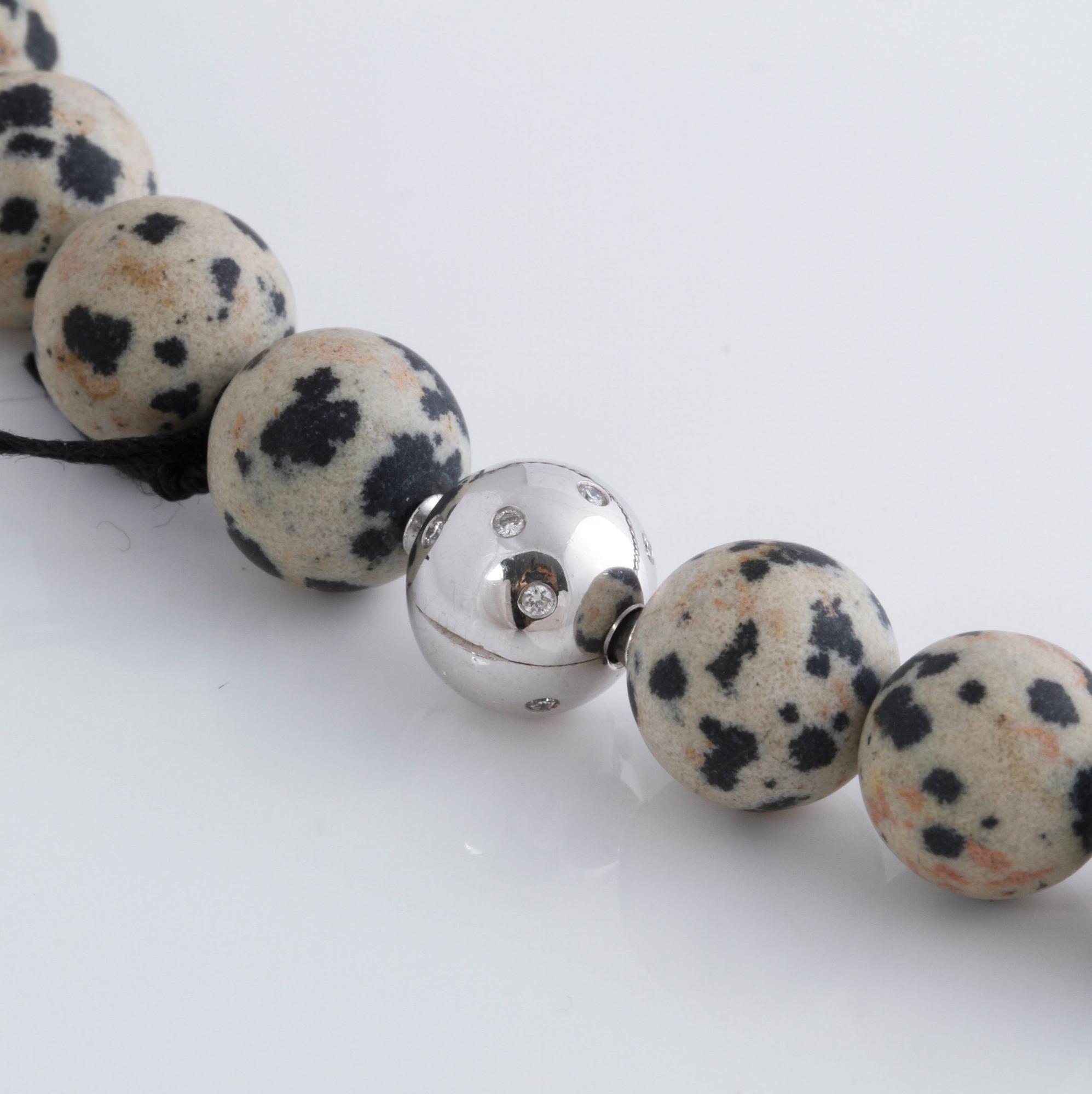 A necklace and clasp with briliant cut diamonds by Ole Lynggaard.