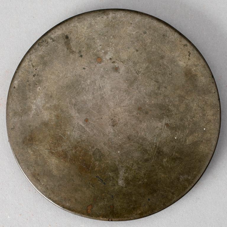 A bronze mirror, presumably Tang dynasty (618-906).