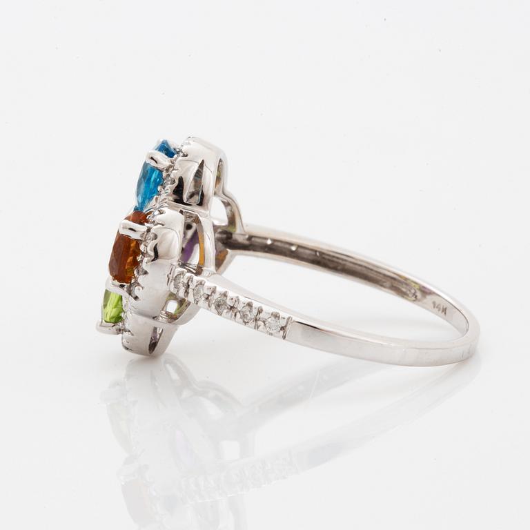 Ring, med fasettslipad topas, ametist, peridot, citrin och briljantslipade diamanter i form av blomma.