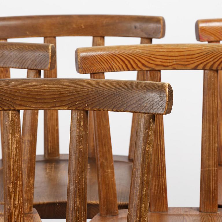 Axel Einar Hjorth, a set of six stained pine "Utö" chairs, Nordiska Kompaniet, Sweden, 1930s.