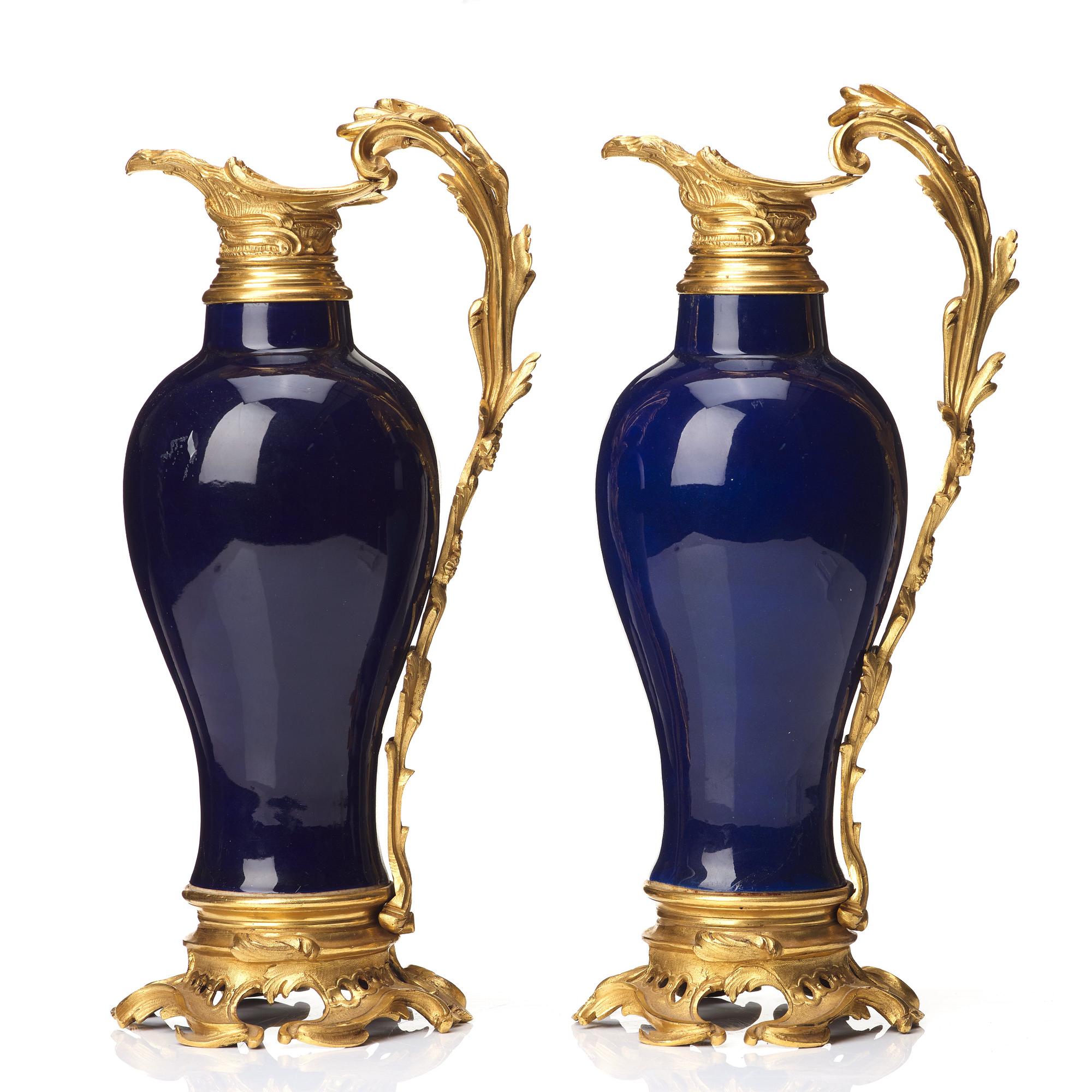 A pair of gilt bronze mounted vases, Qing dynasty, Qianlong (1736-95). French bronze mounts.
