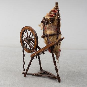 A 19th century spinning wheel.