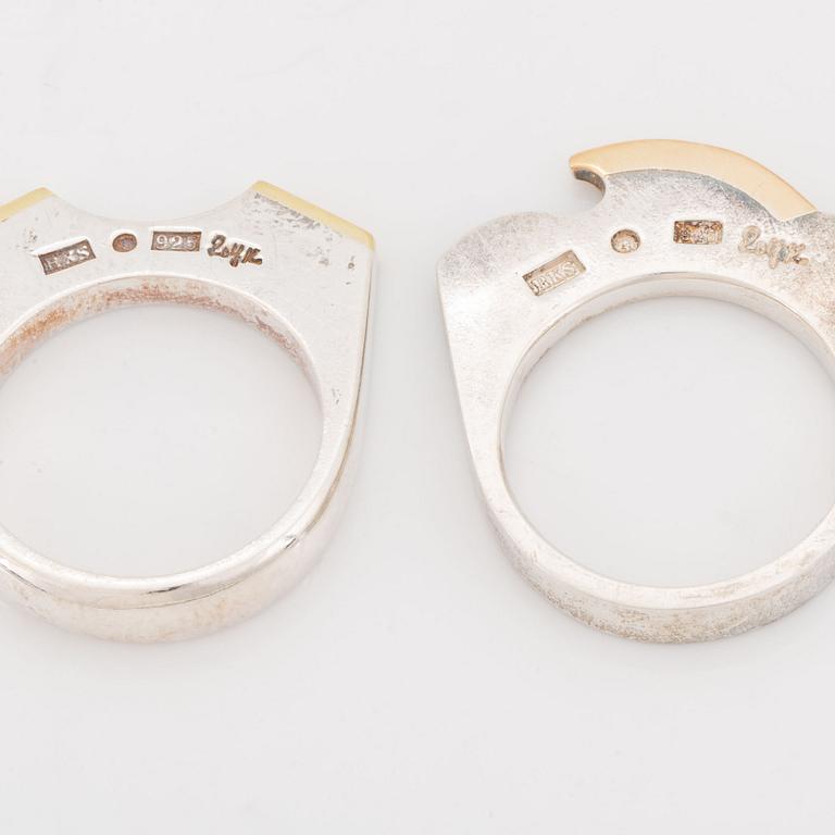 Rolf Karlsson four silver rings with gold details.