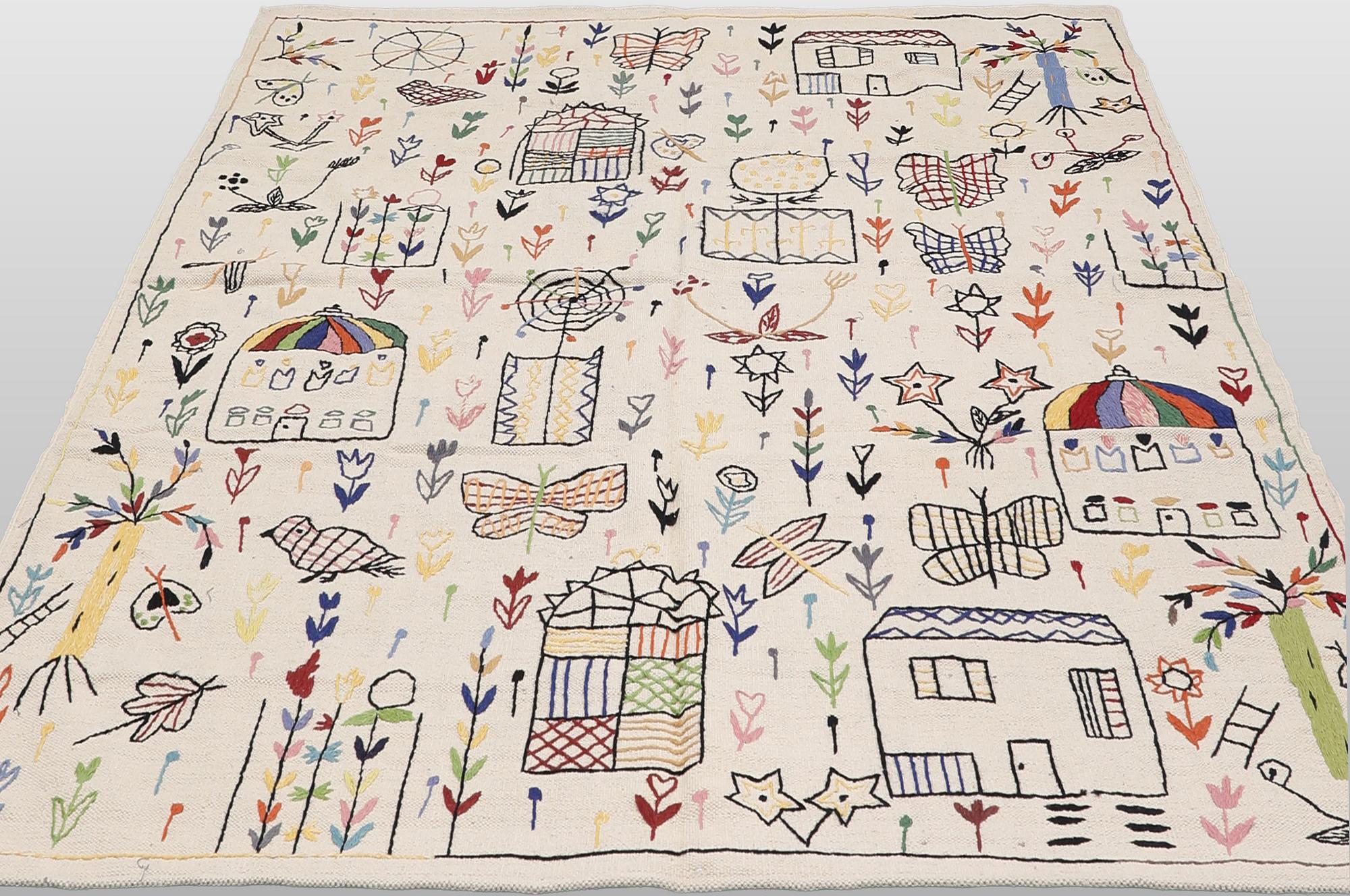 A Kelim carpet with hand-embroidered decoration, 239 x 182 cm.
