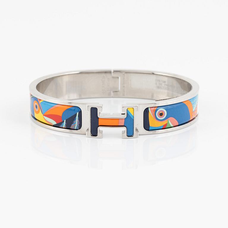 Hermès, a 'Clic H Toucans de Paradis' bracelet.