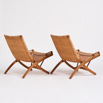 Hans J. Wegner, a pair of oak and rattan folding chairs 'JH-512', Johannes Hansen, Denmark 1950-60s.