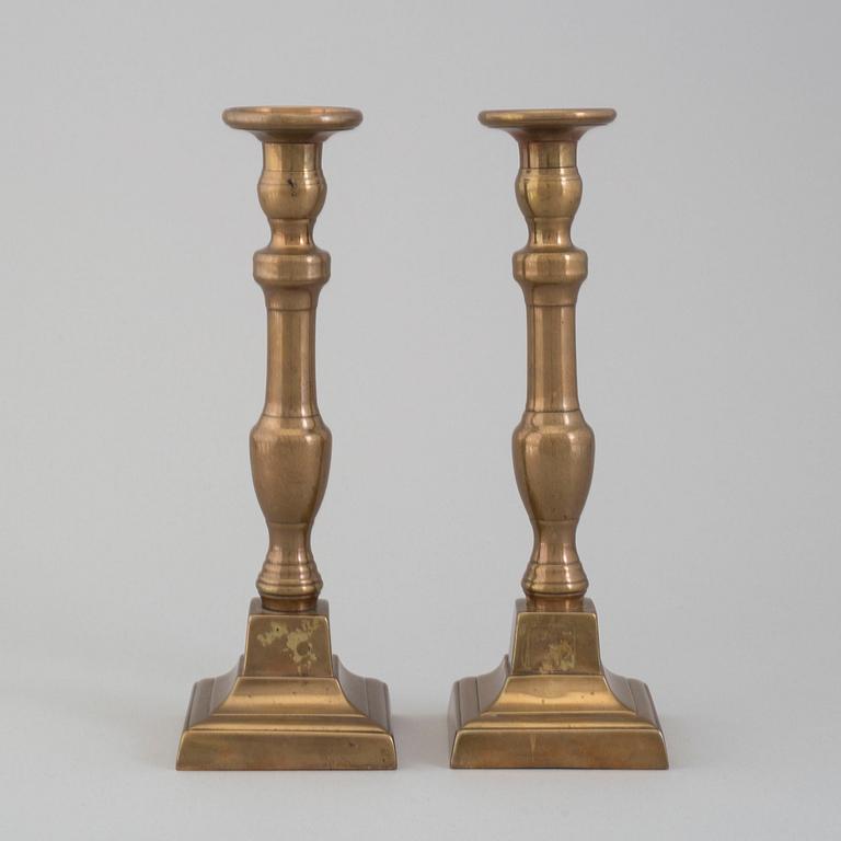 A pair of 19th century bronze candlesticks.