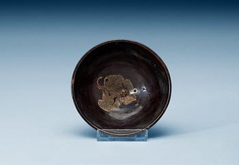 A jizhou yao stoneware bowl with internal relief décor of greyish-yellow leaf, Song dynasty (906-1279).