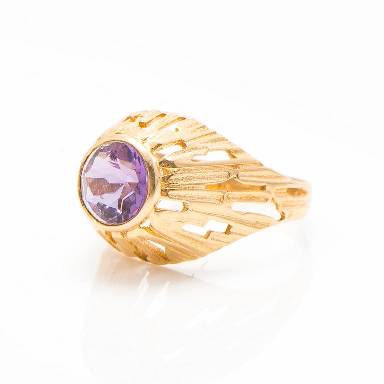 A set of 14K gold earrings and a ring with amethysts.