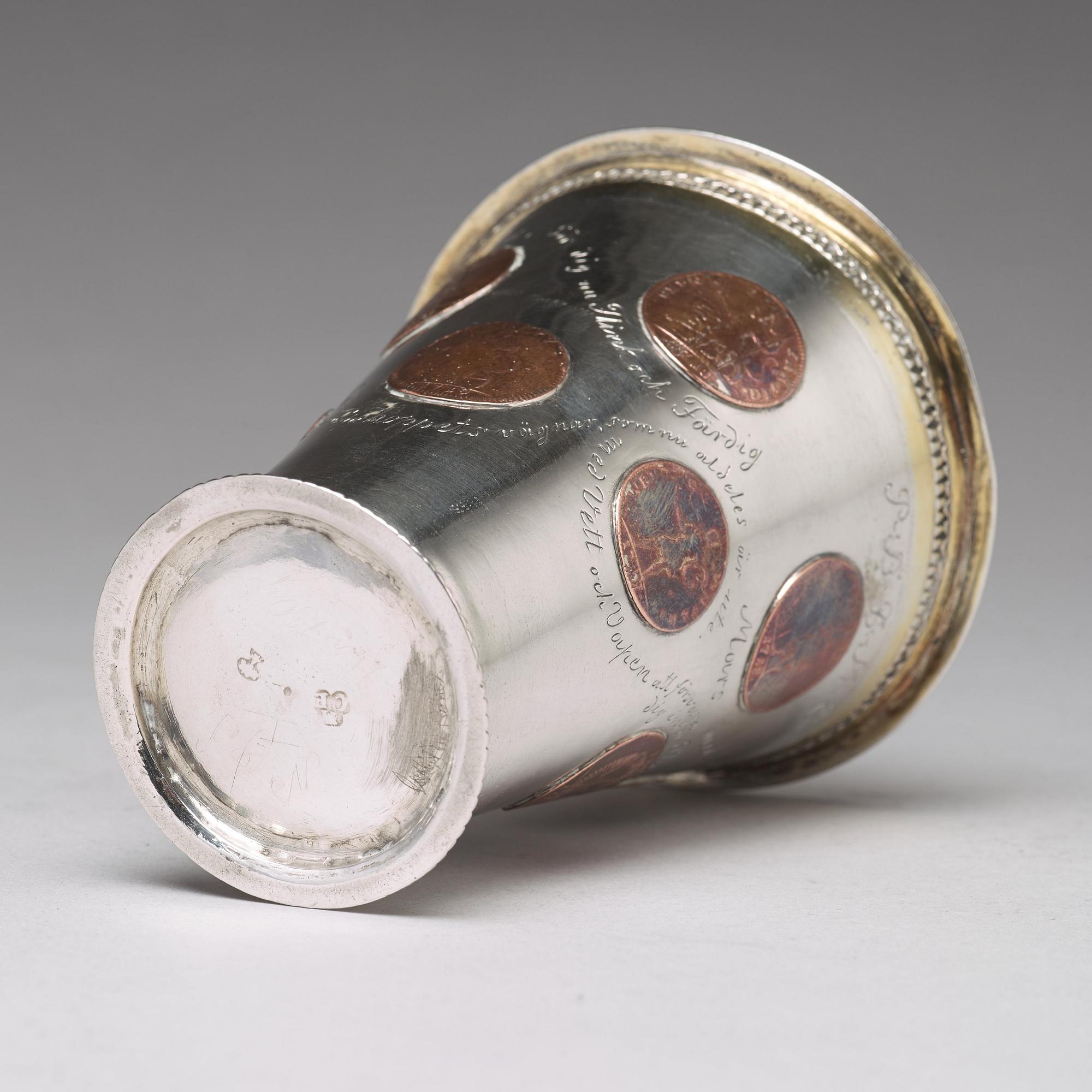 A Swedish 18th century parcel-gilt silver beaker with copper coins, mark of CM Ekman, Eksjö (1729-1738).