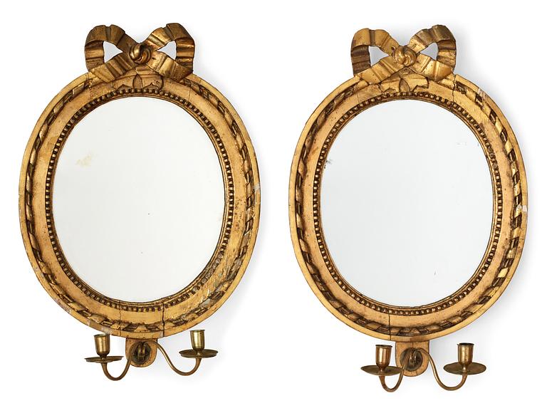 A pair of Gustavian two-light girandole mirrors by E. Wahlberg.