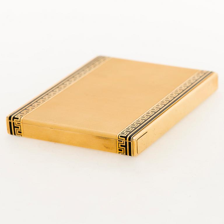 A Cartier cigarette case in 18K gold with black enamel.