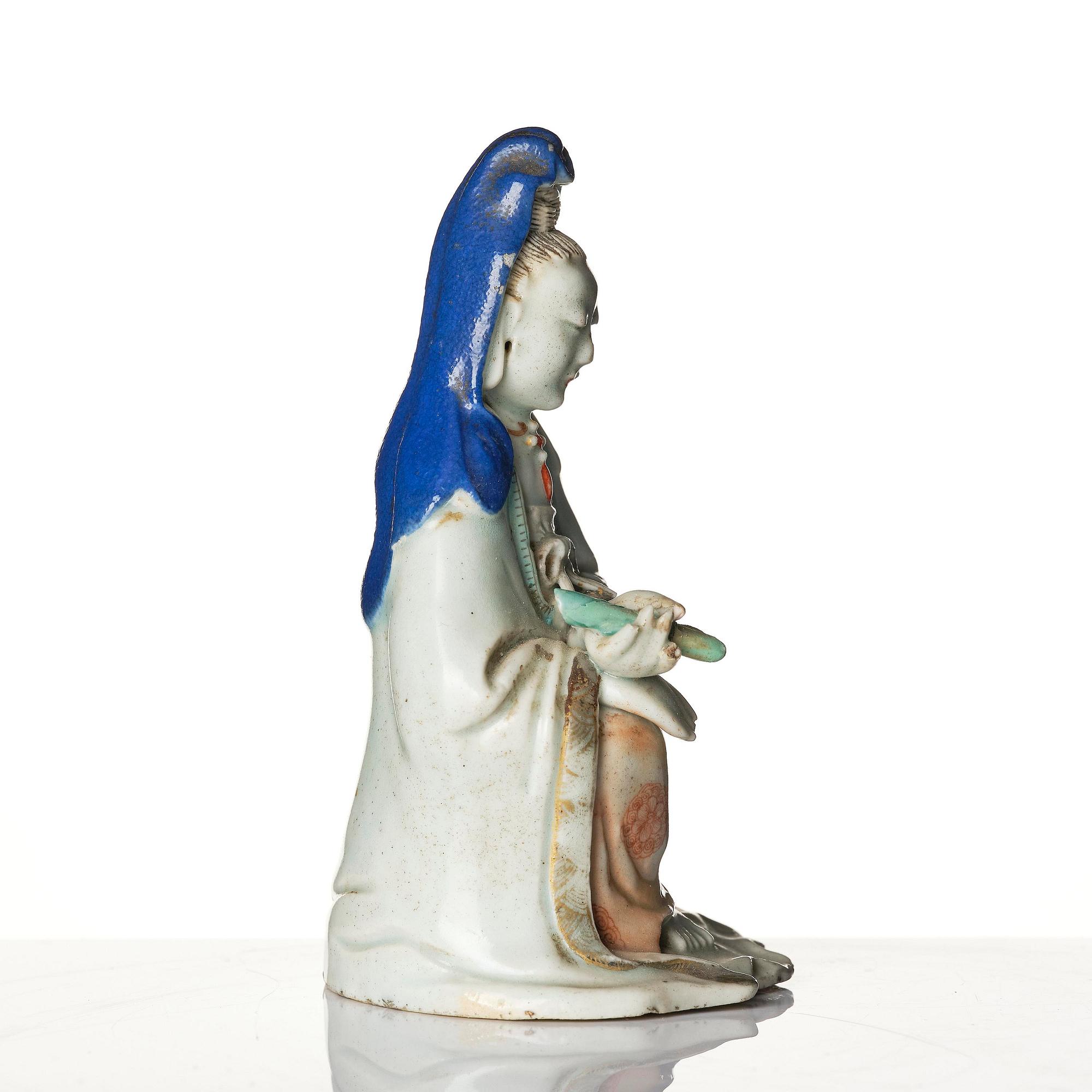 A porcelain figure of Guanyin, Qing dynasty, (1736-95).