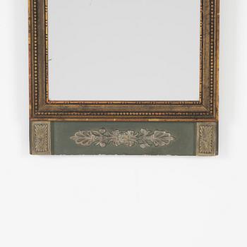 An Empire style mirror, first half of the 20th century.