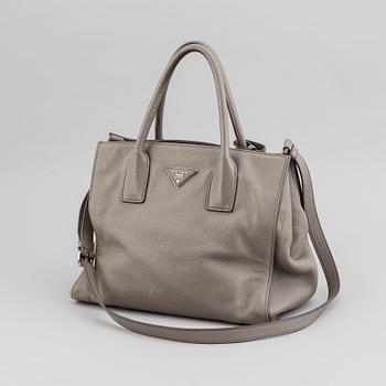 Prada, a leather handbag.