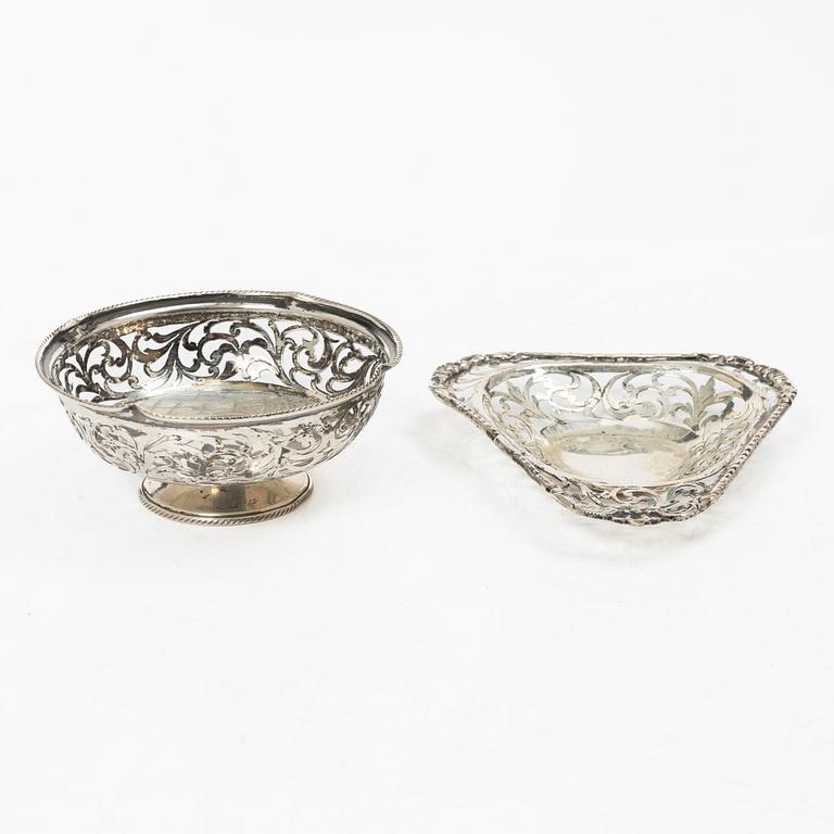 Two pierced silver bowls and two sugar spoons, including Sweden and Endland, 20th century.